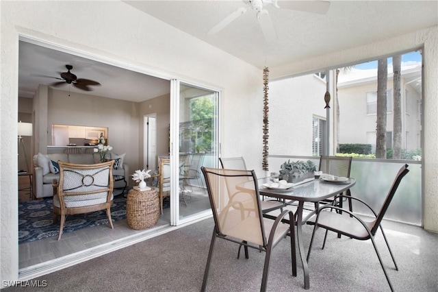 dining room featuring a sunroom and ceiling fan