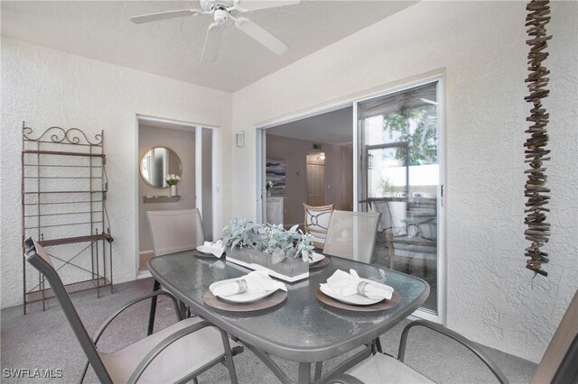 dining room with carpet and ceiling fan