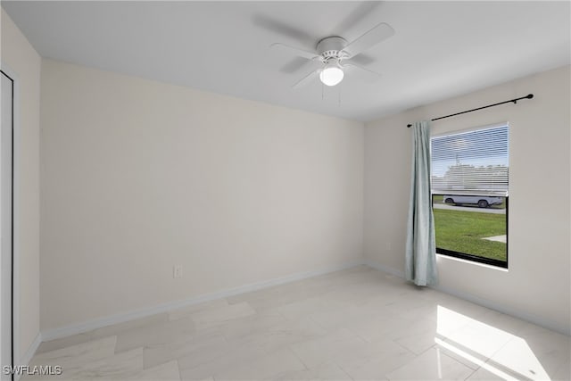 spare room with ceiling fan