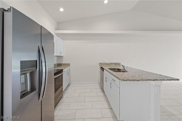 kitchen with stainless steel appliances, white cabinetry, sink, and lofted ceiling