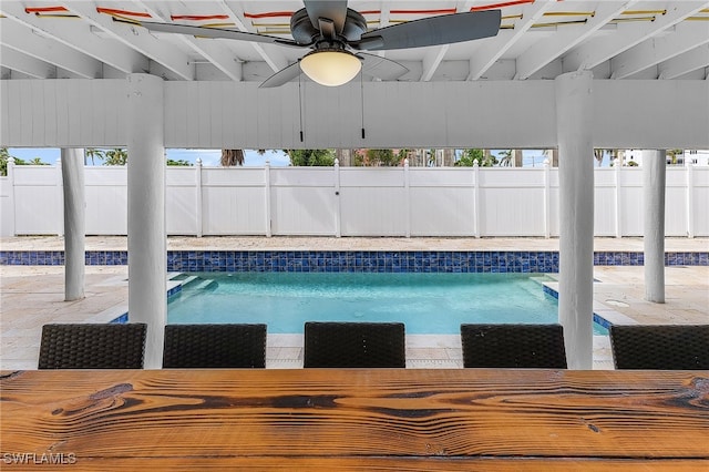 view of swimming pool with a patio and ceiling fan