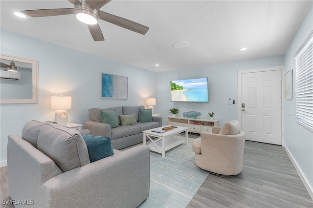 living room with light wood-type flooring and ceiling fan