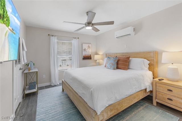 bedroom featuring a wall unit AC, dark wood-type flooring, and ceiling fan