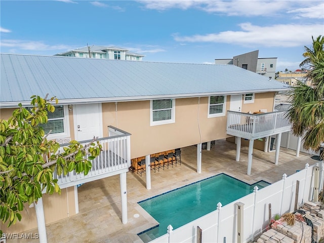 view of pool featuring a patio