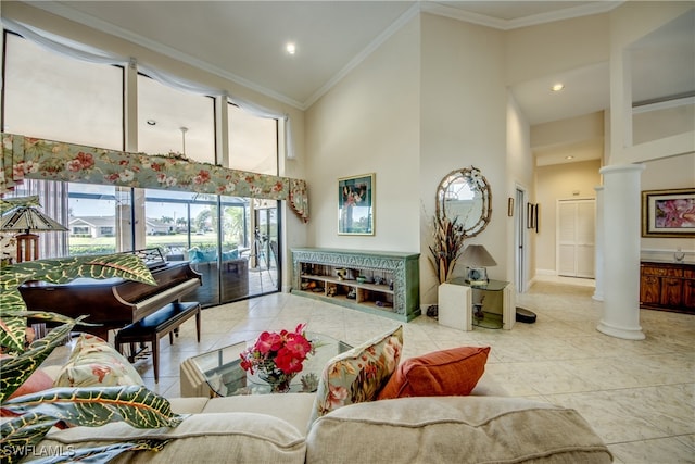 living room with high vaulted ceiling, decorative columns, light tile patterned flooring, and crown molding