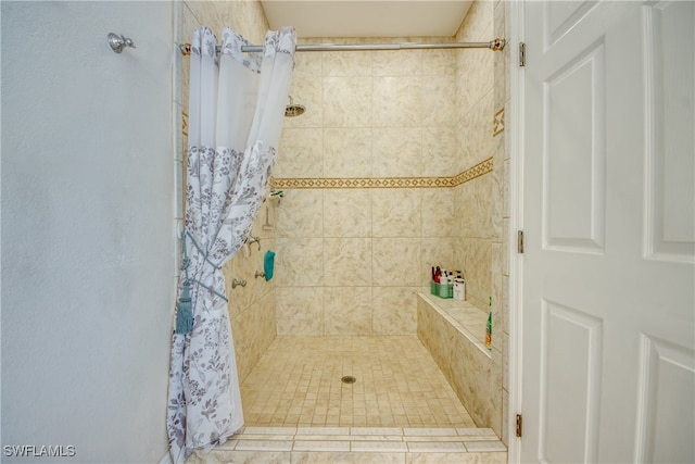 bathroom with a shower with shower curtain