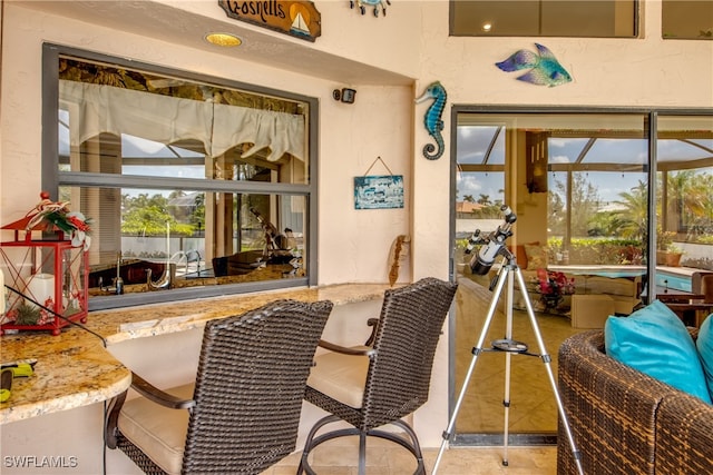 sunroom featuring a wealth of natural light