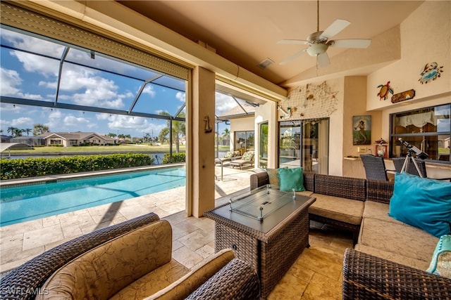 exterior space featuring a patio, ceiling fan, outdoor lounge area, and glass enclosure