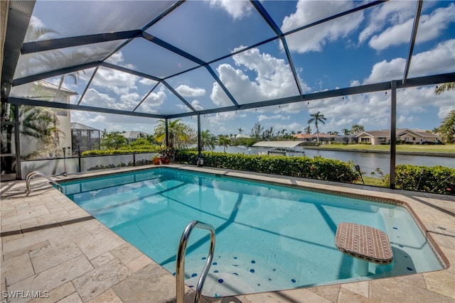 view of pool with a water view, glass enclosure, and a patio