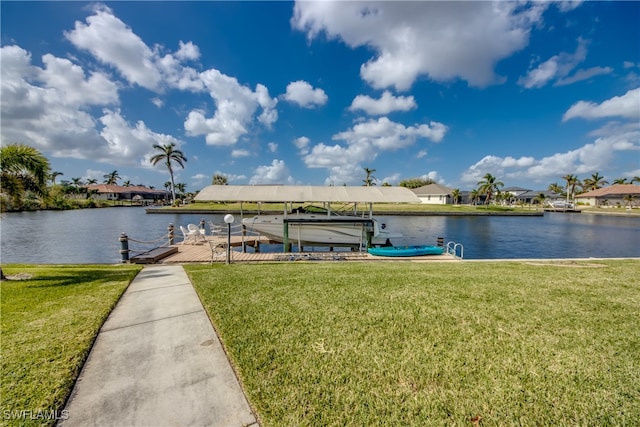 view of dock featuring a lawn and a water view