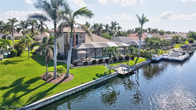 dock area featuring a yard, a water view, and a lanai