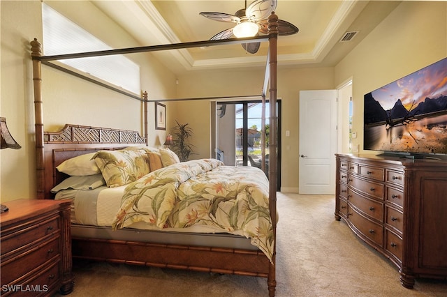 carpeted bedroom featuring access to exterior, ceiling fan, a raised ceiling, and ornamental molding