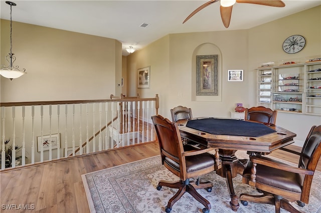 dining area with hardwood / wood-style flooring and ceiling fan