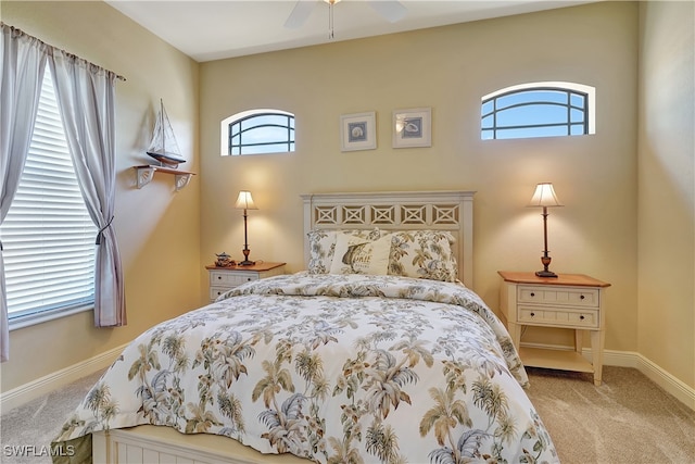 bedroom with light colored carpet and ceiling fan