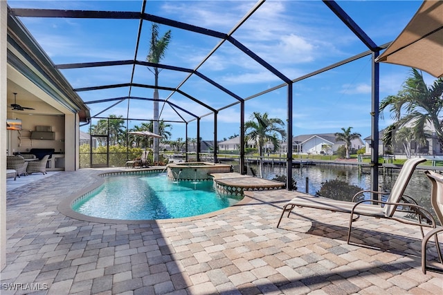 view of swimming pool with a patio area, a dock, a water view, and glass enclosure