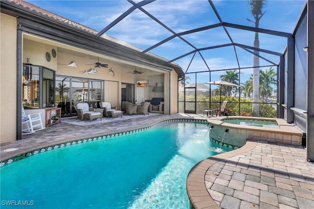 view of swimming pool with an in ground hot tub, outdoor lounge area, ceiling fan, glass enclosure, and a patio