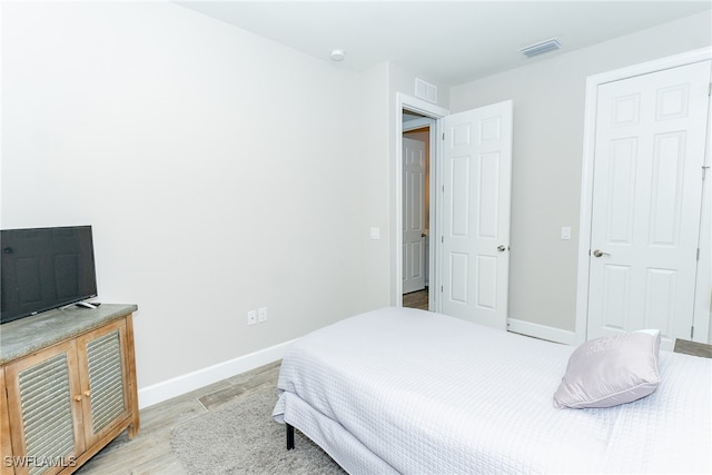 bedroom featuring light hardwood / wood-style floors
