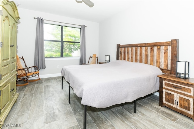 bedroom featuring hardwood / wood-style floors and ceiling fan