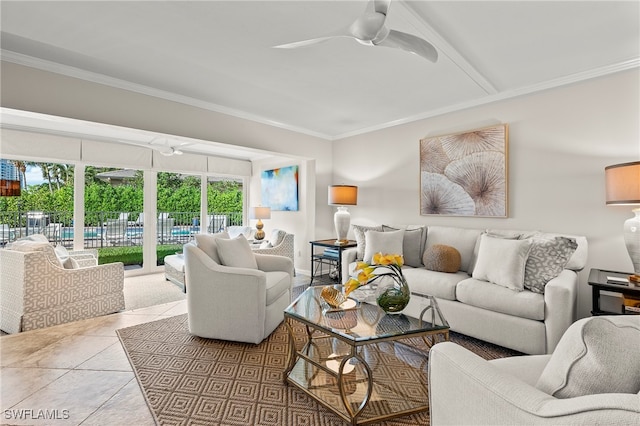 living room featuring tile patterned floors, ornamental molding, and ceiling fan