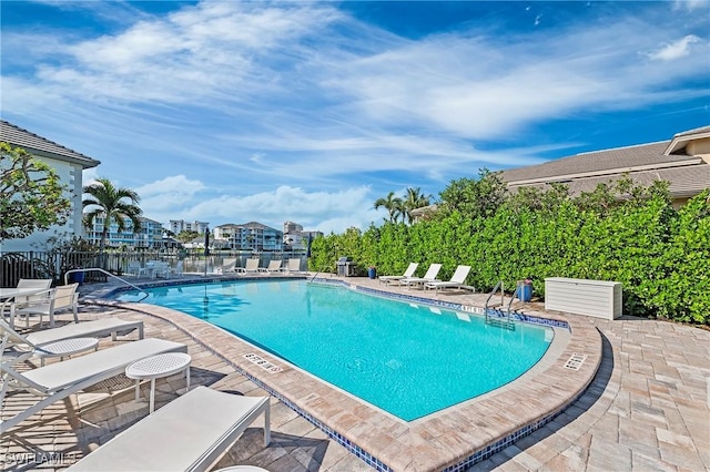 view of swimming pool featuring a patio area