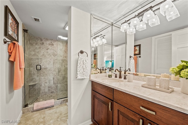 bathroom with vanity and a shower with shower door