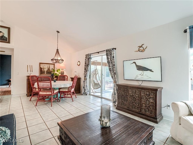 living room featuring lofted ceiling and light tile patterned floors