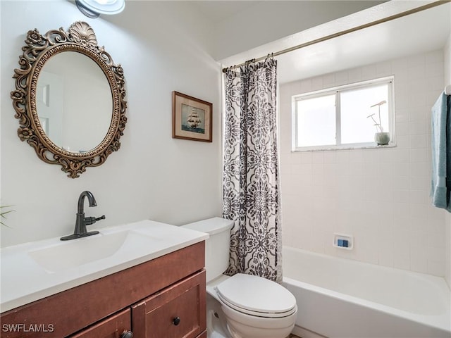 full bathroom with shower / bathtub combination with curtain, vanity, and toilet