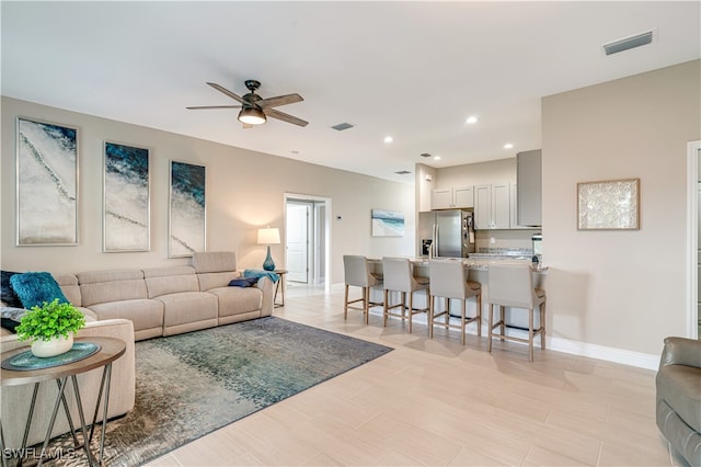 living room with ceiling fan