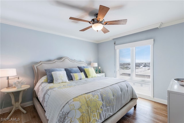 bedroom featuring wood-type flooring, ceiling fan, and crown molding