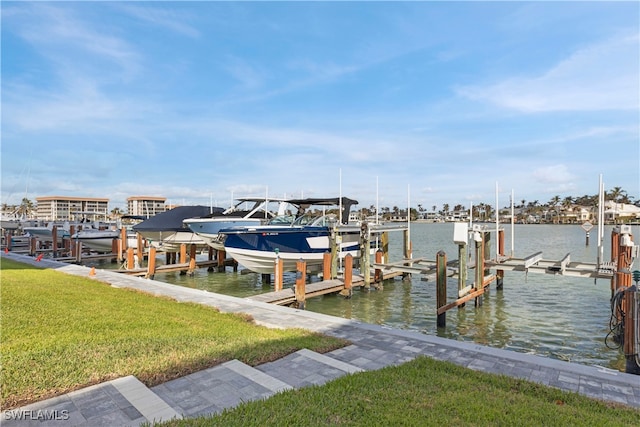 dock area featuring a water view and a lawn