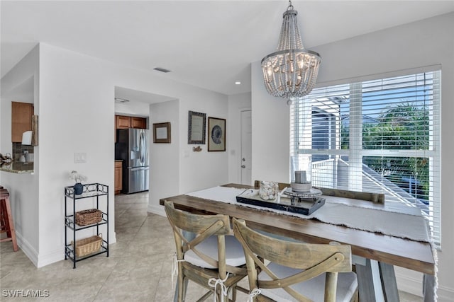 dining space featuring a chandelier