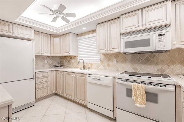 kitchen featuring sink, ceiling fan, light tile patterned floors, white appliances, and decorative backsplash