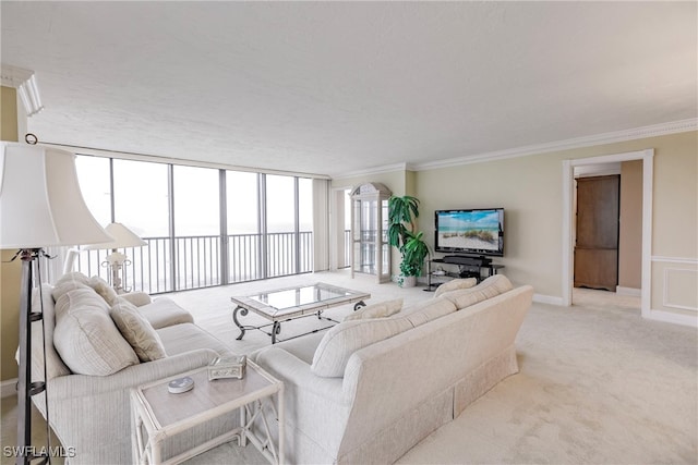 carpeted living room with ornamental molding