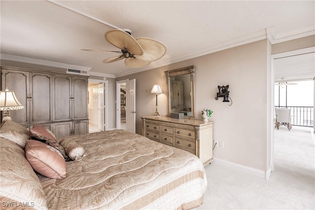 carpeted bedroom featuring ceiling fan and crown molding