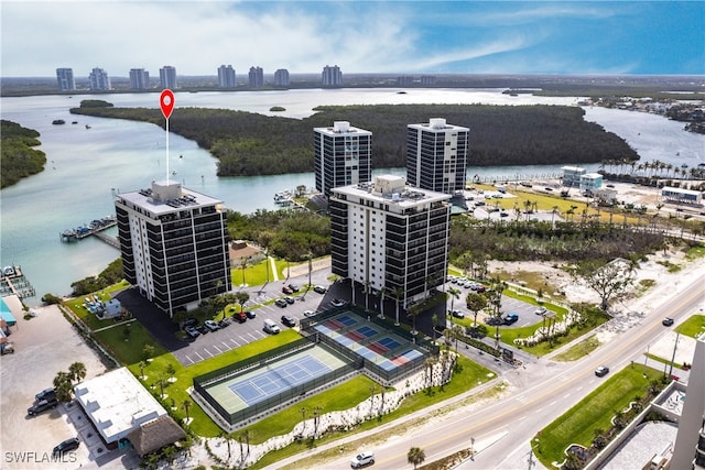 birds eye view of property featuring a water view and a city view