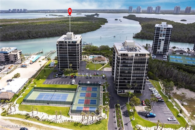 birds eye view of property with a city view and a water view
