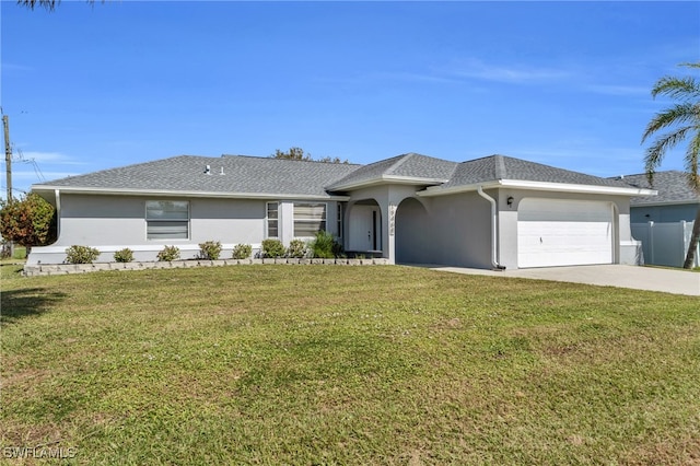 ranch-style home featuring a garage and a front yard