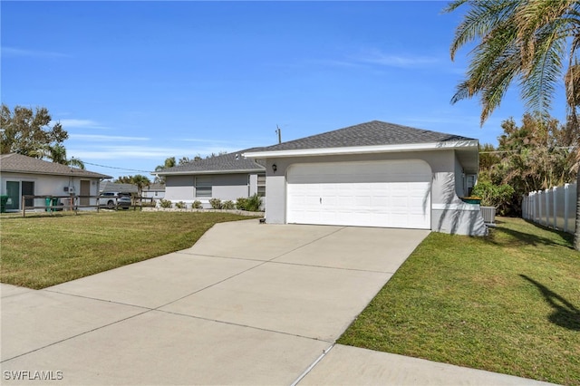 ranch-style house with a garage and a front yard