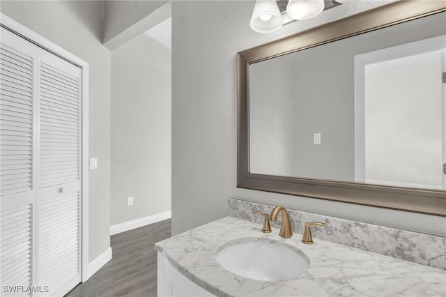 bathroom with vanity and hardwood / wood-style floors