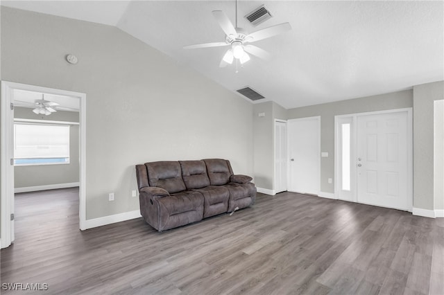 living room with lofted ceiling, hardwood / wood-style floors, and ceiling fan