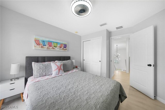 2532 Blackburn Cir, Cape Coral, FL 33991 - bedroom featuring light wood-style floors, a closet, and baseboards