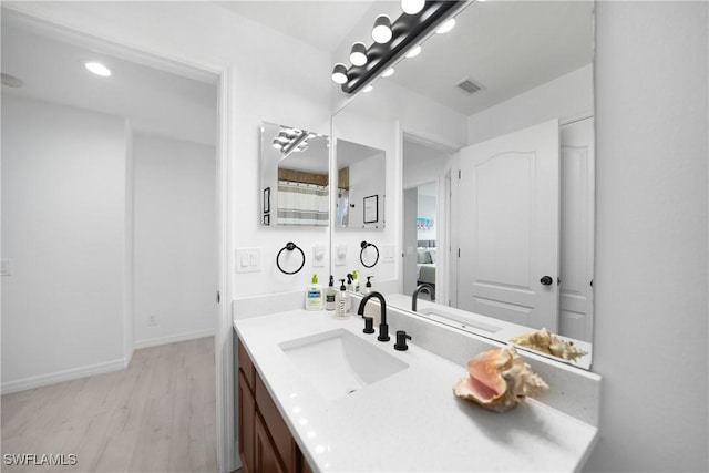 2532 Blackburn Cir, Cape Coral, FL 33991 - full bathroom featuring wood finished floors, vanity, and baseboards