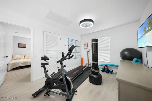 2532 Blackburn Cir, Cape Coral, FL 33991 - exercise room with wood finished floors, attic access, and baseboards