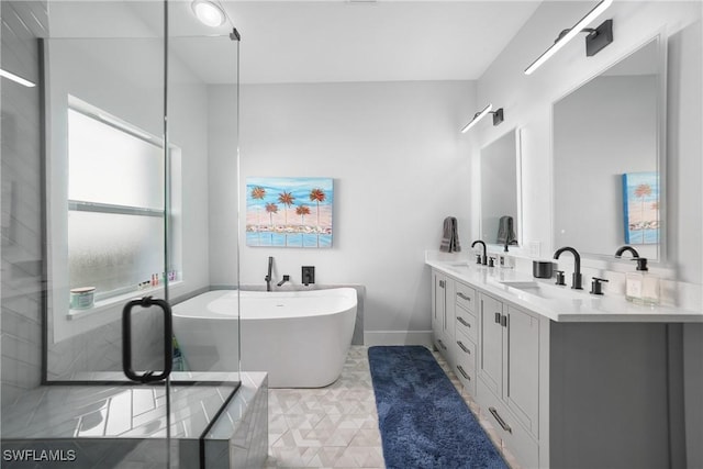 2532 Blackburn Cir, Cape Coral, FL 33991 - bathroom with a freestanding tub, double vanity, baseboards, and tile patterned flooring