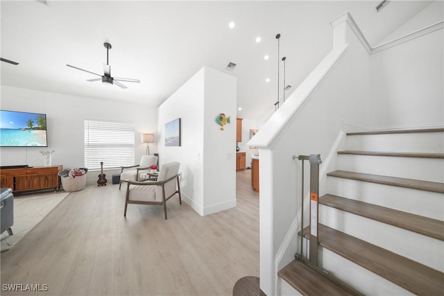 2532 Blackburn Cir, Cape Coral, FL 33991 - staircase with ceiling fan, wood finished floors, baseboards, and lofted ceiling