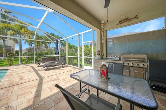 2532 Blackburn Cir, Cape Coral, FL 33991 - view of patio with a grill, exterior kitchen, ceiling fan, glass enclosure, and outdoor dining area