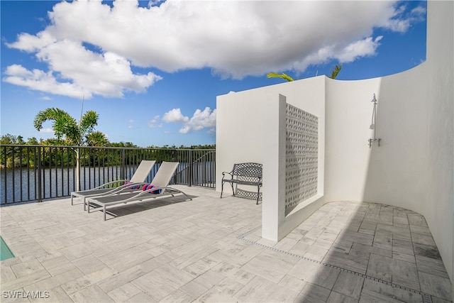 view of patio / terrace with a water view