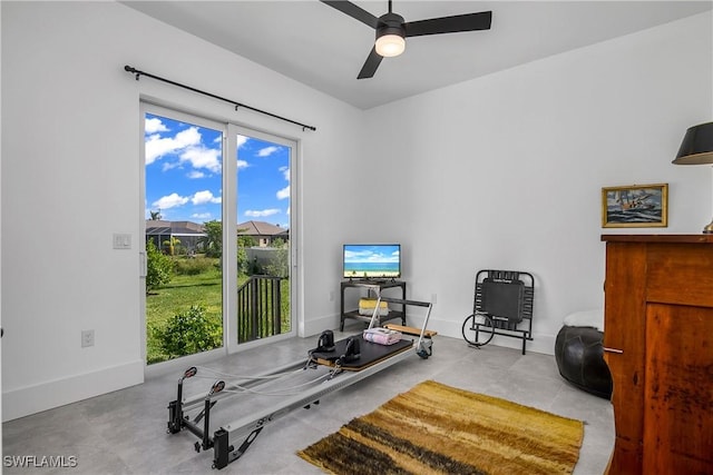 exercise room with ceiling fan