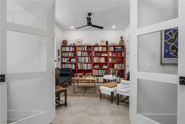 sitting room featuring ceiling fan