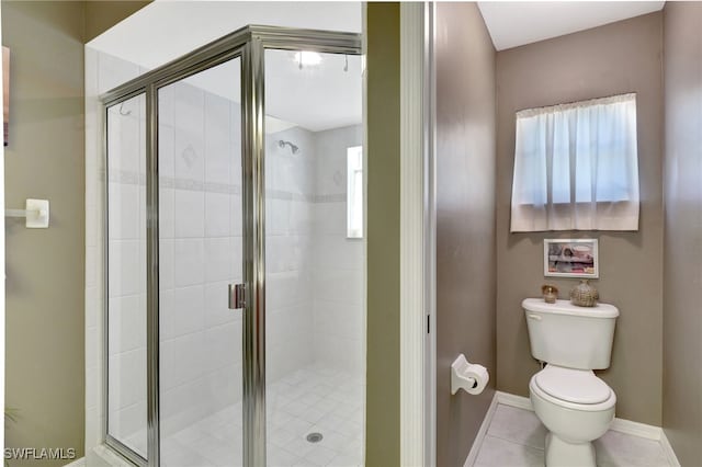 bathroom with toilet, an enclosed shower, and tile patterned flooring